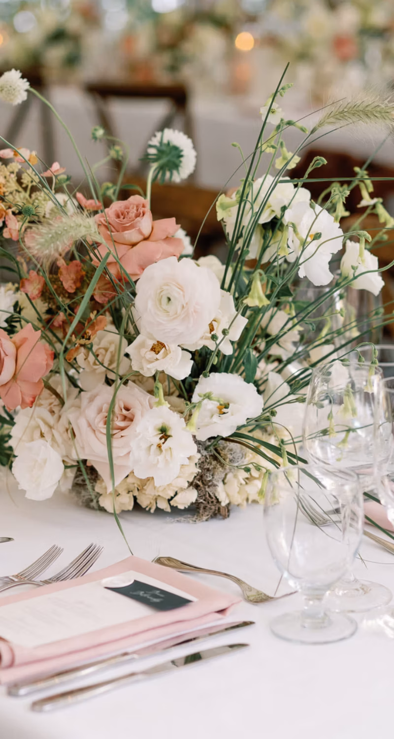 Chic wedding table with floral centerpiece and candles
